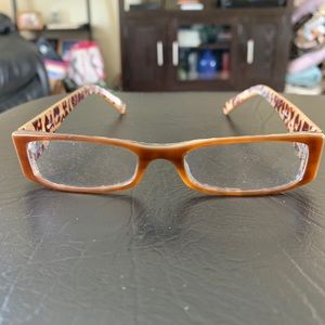 Snazzy tan with animal print glasses.